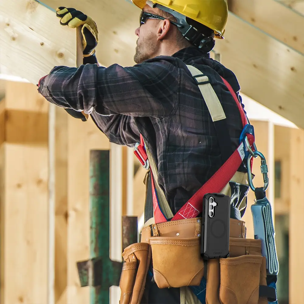 Samsung Galaxy S25 Plus case with belt clip worn by construction worker.