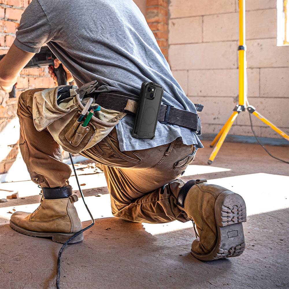 Heavy-duty iPhone 15 Plus holster with belt clip, rugged construction worker setting.