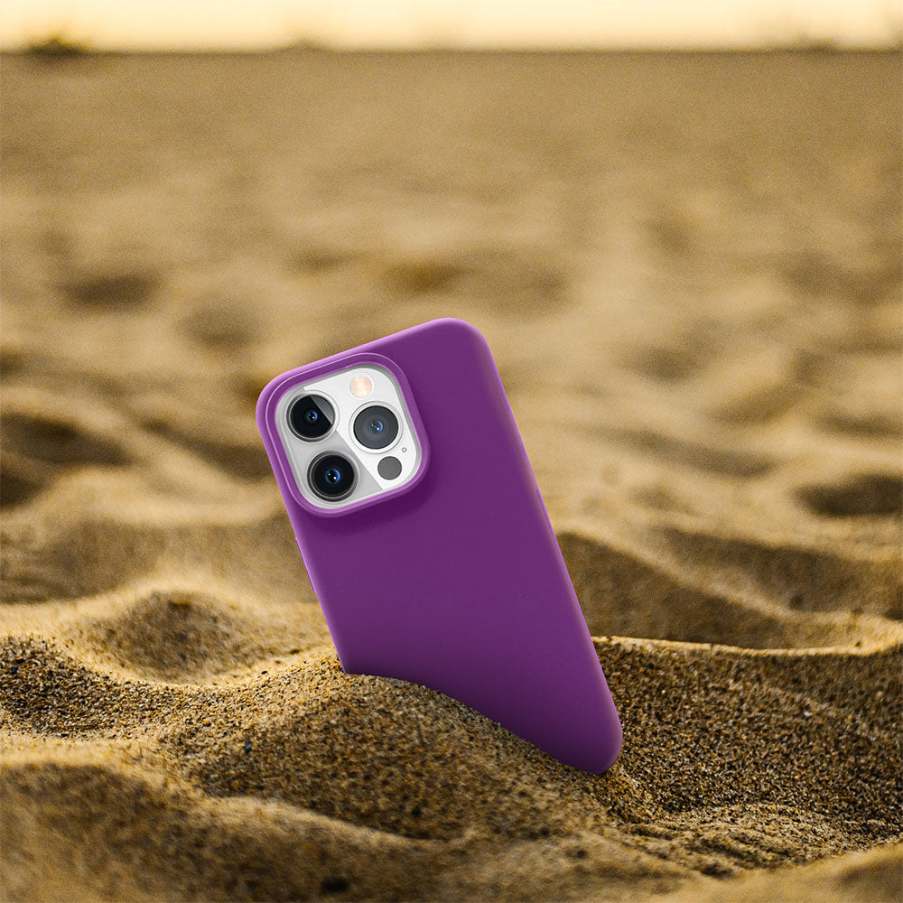 Silicone Case for iPhone 15 Pro on sandy beach background showcasing style and protection.